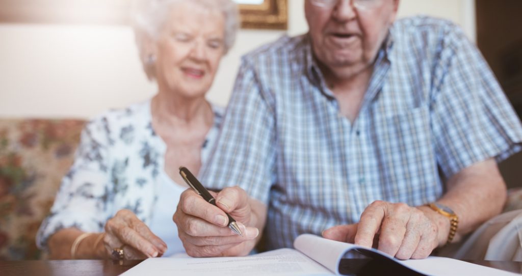 bigstock Senior Couple Signing Their Will 131945624 1800 x 850