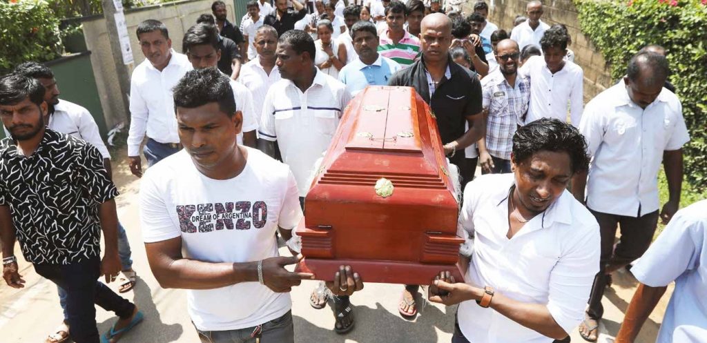 Friends and relatives carry the coffin of one of the victims of the suicide bomb attacks on churches and luxury hotels on Easter Sunday in Sri Lanka. Photo: Reuters/Athit Perawongmetha.
