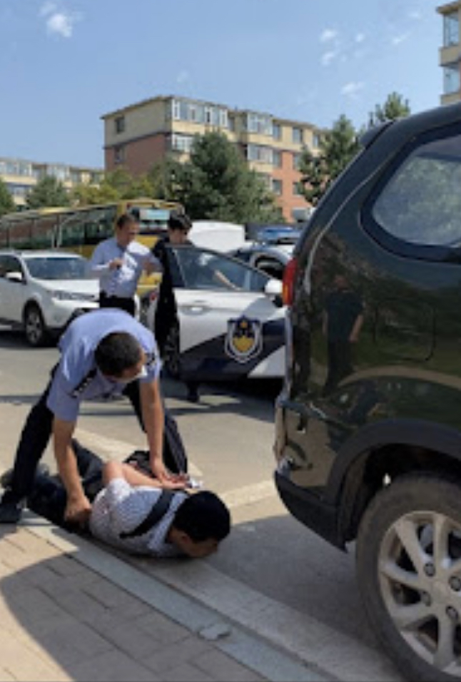 Pastor Guo Muyun was taken into a police car and Zhang Liangliang was pinned to the ground ChinaAid