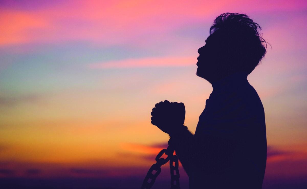 Silhouette,man,with,chain,freedom,,worship,and,pray.repent,of,wrong