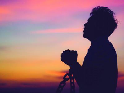 Silhouette,man,with,chain,freedom,,worship,and,pray.repent,of,wrong